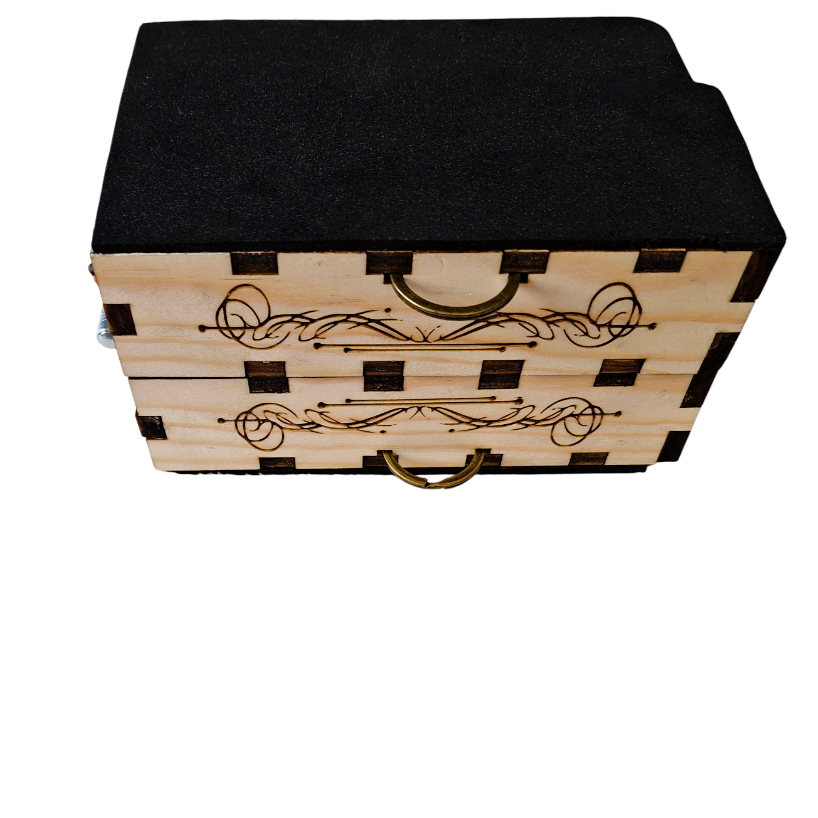 a top front oblique view of The  rhythmic, showing how it can be folded for transport. Both boxes laying face-outwards and stacked upon each other, connected by a metal hinge.