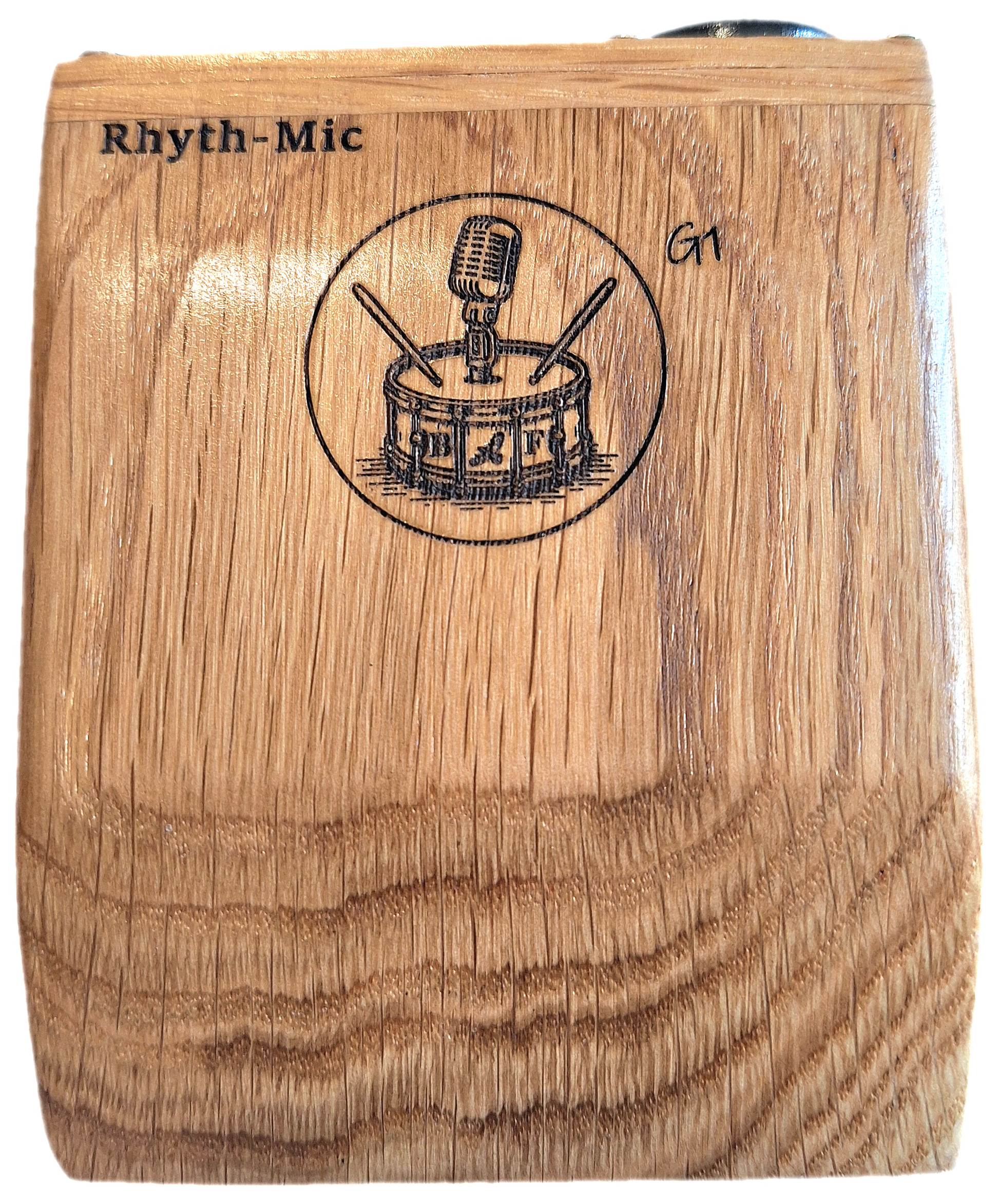 A close up view of the top of the Rhyth-Mic G1 Stomp box showing the oak attractive oak construction and laser etched graphics and branding