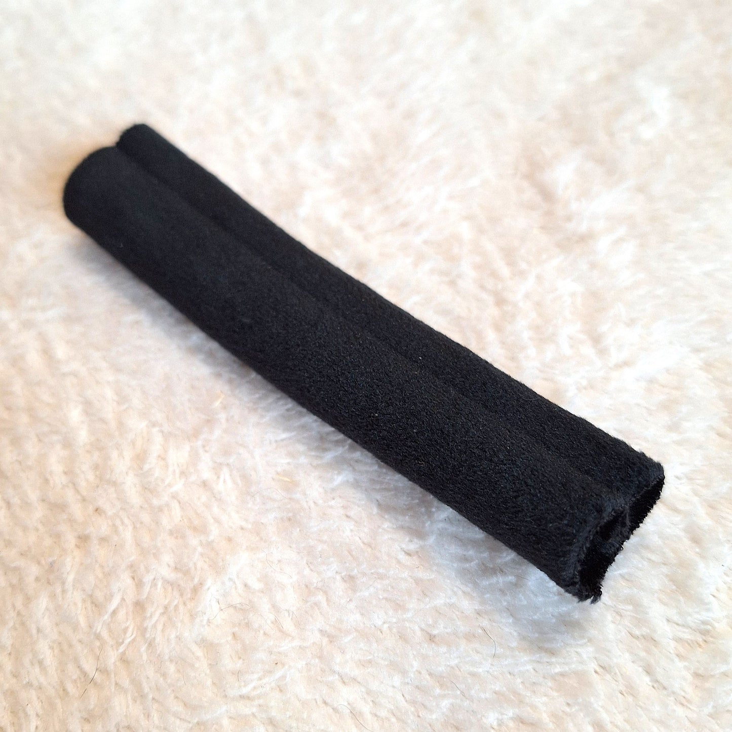 black velvet tube, approx 15cm long and wide enough to cover a 9v battery