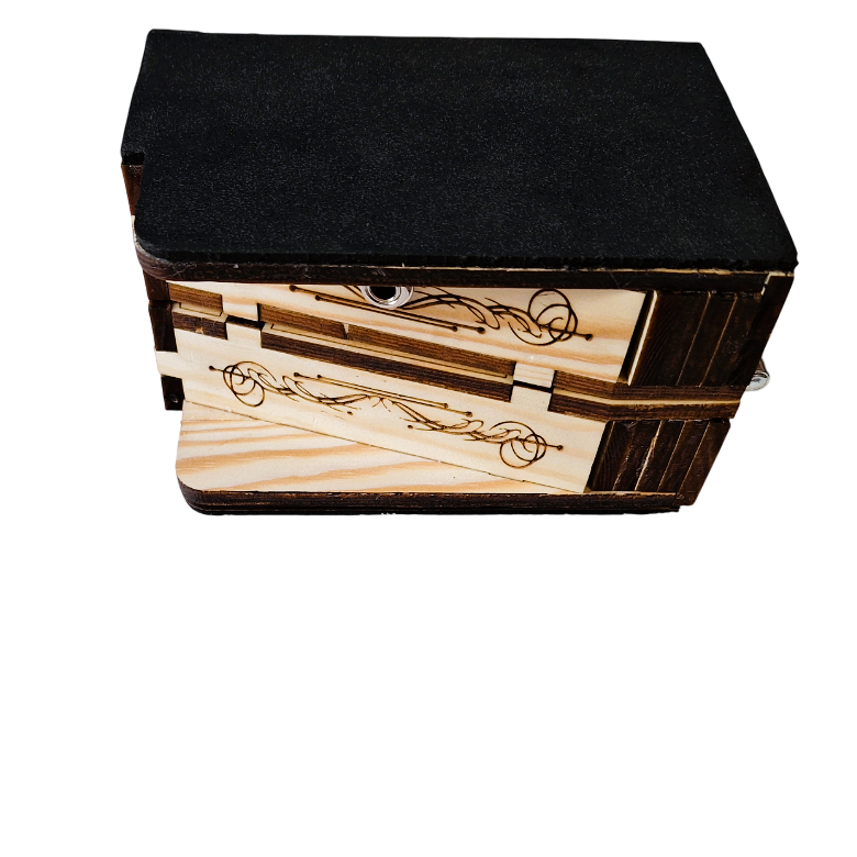 bottom side view of The  rhythmic, showing how it can be folded for transport. Both boxes laying face-outwards and stacked upon each other, connected by a metal hinge.
